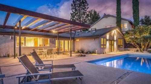 Captivating mid-century remodel backyard in Westlake Village by JRP Design and Remodel