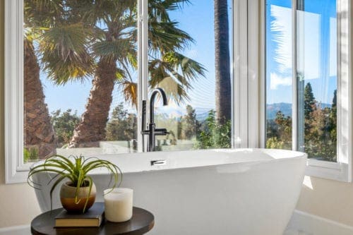 Master bathroom soaking tub with gorgeous view in Camarillo by JRP Design and Remodel