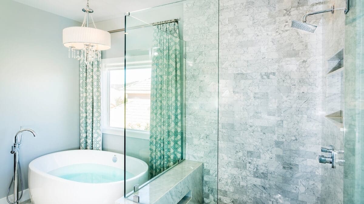 grey and teal master bathroom with stand alone tub and marble tile. Remodeling Contractor Lake Sherwood